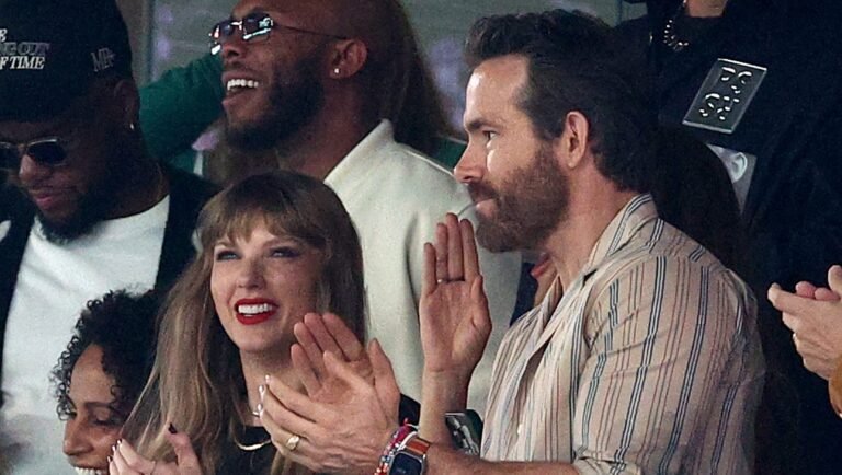 EAST RUTHERFORD, NEW JERSEY - OCTOBER 01: (L-R) Singer Taylor Swift and Actor Ryan Reynolds cheer prior to the game between the Kansas City Chiefs and the New York Jets at MetLife Stadium on October 01, 2023 in East Rutherford, New Jersey. (Photo by Elsa/Getty Images)