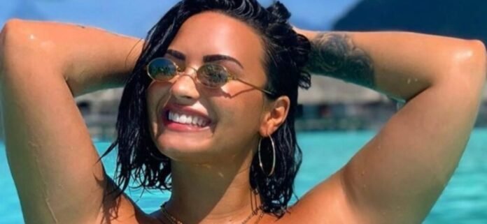 Demi Lovato All Smiles In Birthday Swimsuit With A Pickle Jar