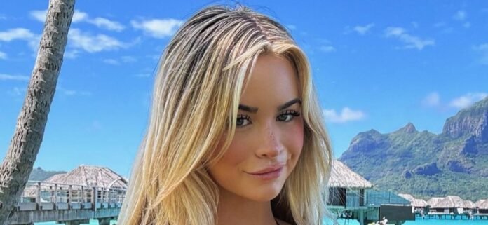 Emily Elizabeth Teases Plenty Of Skin In An Itsy-Bitsy Black Bikini