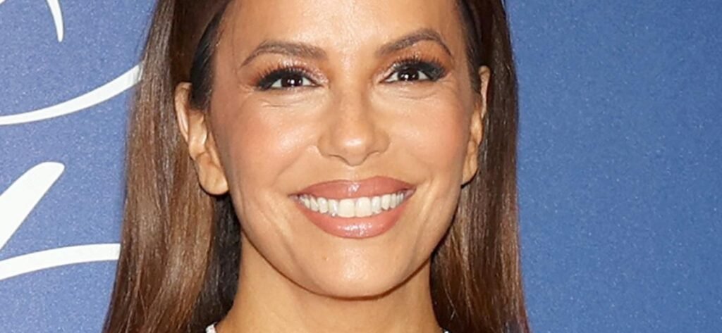 Eva Longoria Shows Off Her New 'Enhancements' In Plunging Red Dress