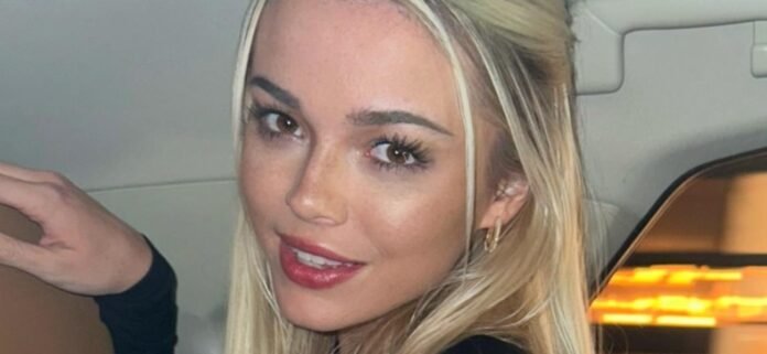 Gymnast Olivia Dunne Rolls Around Her Bed In Underwear And Crocs