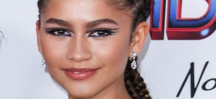 Zendaya Impresses In Outdoors In Braless Neck Scarf