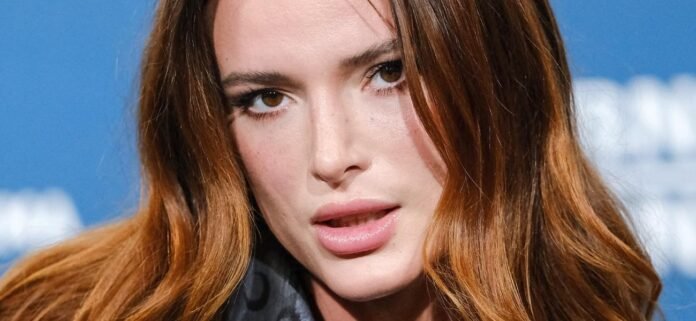 Bella Thorne Sparks Hygiene Comments In Sheer Braless Dress