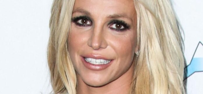 Britney Spears Tugs Down Schoolgirl Miniskirt In Skimpy Bikini