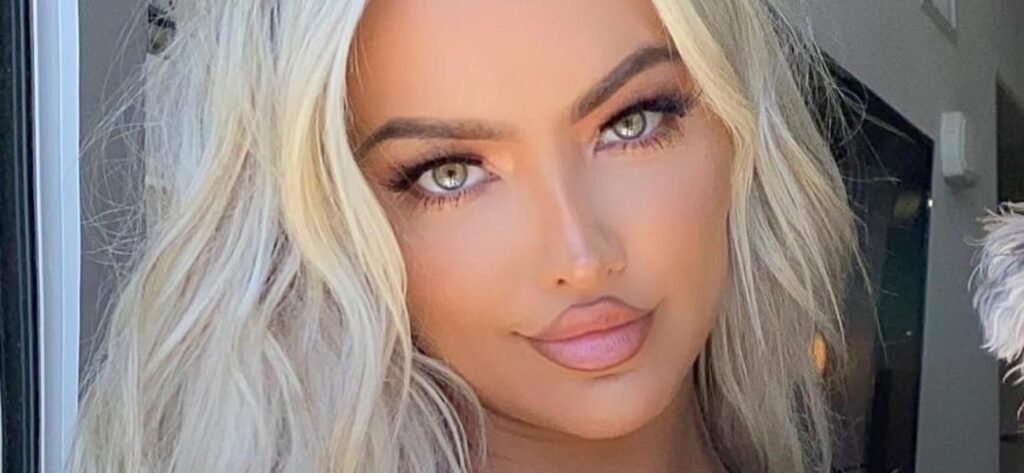 Lindsey Pelas Raises Her Braless Shirt On The Beach