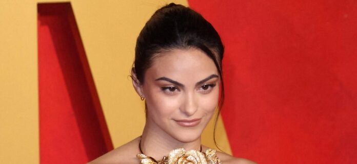 Camila Mendes Shows Off Her Abs In Unbuttoned Striped Pyjamas