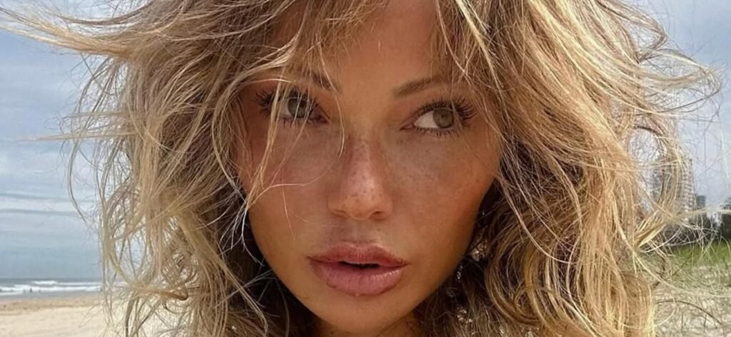 Abby Dowse Rides A Scooter In A Pink Plaid Bikini: 'Comin In Hot'