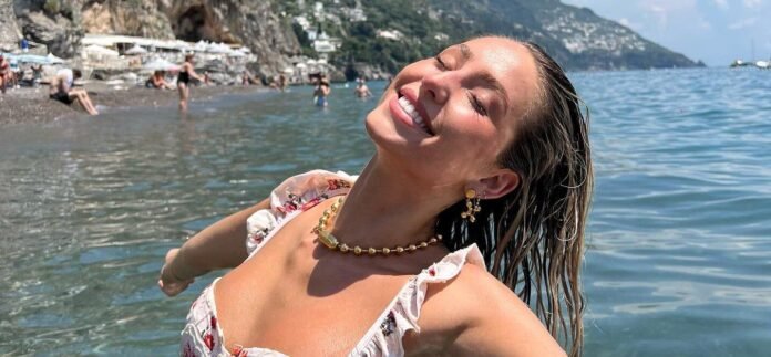 Alix Earle’s Bikini Is Holding On For Dear Life In This Wild Paddleboard Pic