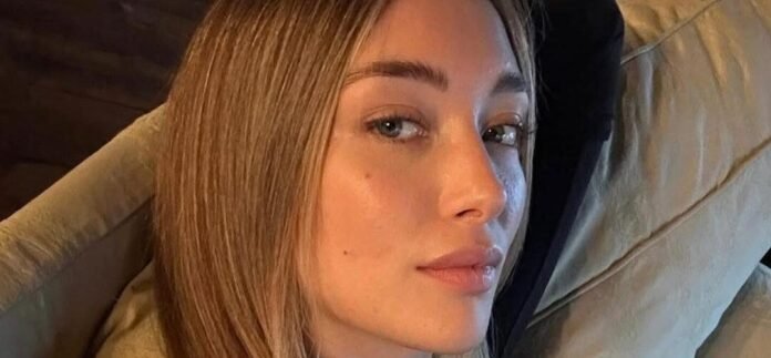 Penny Lane’s Bare-Backed Sports Illustrated Swimsuit Promo Gets A 'Standing Ovation'