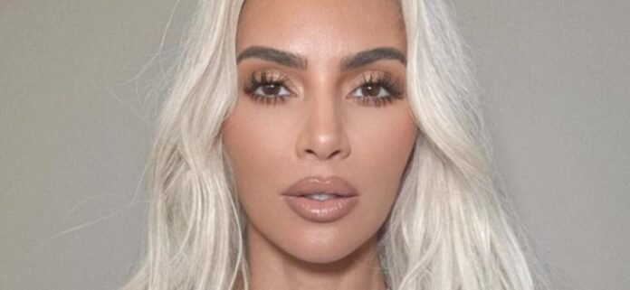 Kim Kardashian Shows Off 'New Implants' In Plunging Swimsuit
