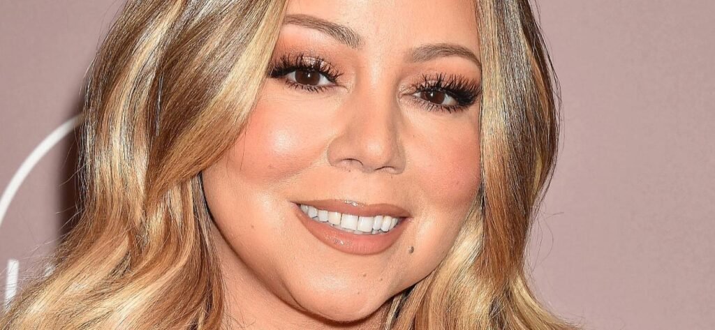 Mariah Carey Looks 'Uncomfortable' In Braless Glitter Minidress And High Heels
