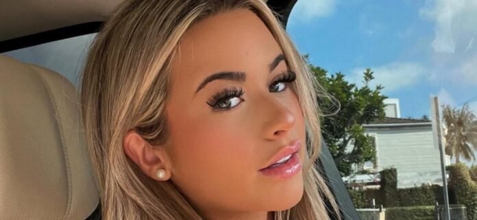 Emily Elizabeth Shows Eye-Popping Backside View In A Tiny White Bikini