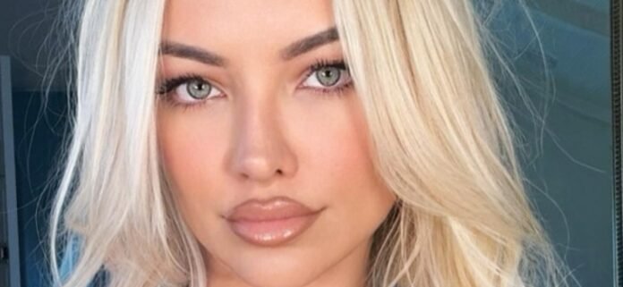 Lindsey Pelas Thrills In Plunging Swimsuit And Heels With 'Staring Contest'