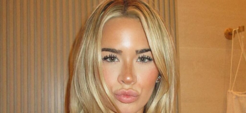Emily Elizabeth Tugging On Her Printed Bikini Looks 'Scorching Hot'