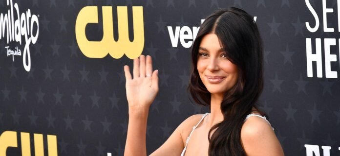 Camila Morrone Turns Heads in Tiny Black Bikini And Sheer Dress In Ibiza