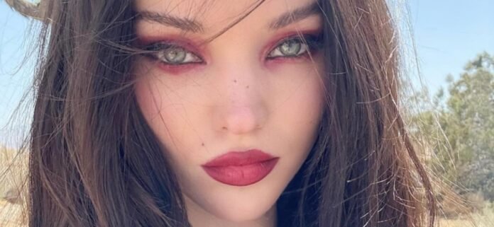 Dove Cameron Freeing The Nipple Called A 'Blow-Up Doll' In Sheer Top