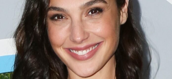 Gal Gadot In Skintight Swimsuit Highlights 'Wonder Woman' Body With Tongue Out