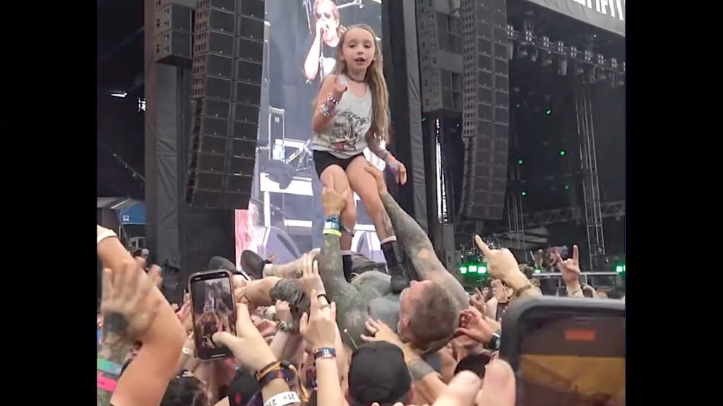 Little Girl Literally Surfs on Top of Crowd-Surfing Dad at Metal Fest: Watch