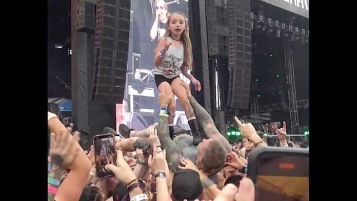 Little Girl Literally Surfs on Top of Crowd-Surfing Dad at Metal Fest: Watch