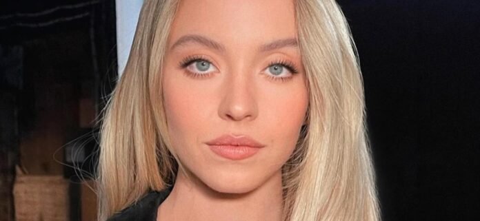 Sydney Sweeney In Plunging Swimsuit Is 'Triggering Fat Women' With Beach Walk