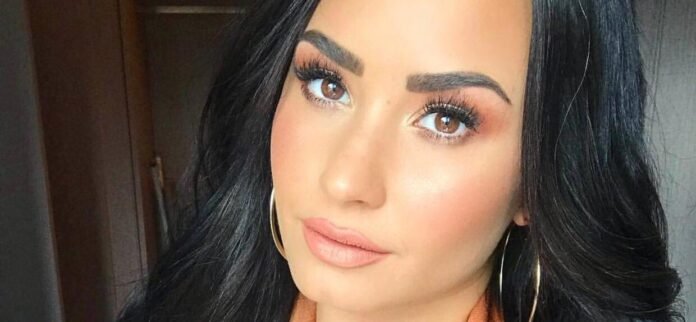 Demi Lovato In Skimpy Orange Bikini 'Looks 63'
