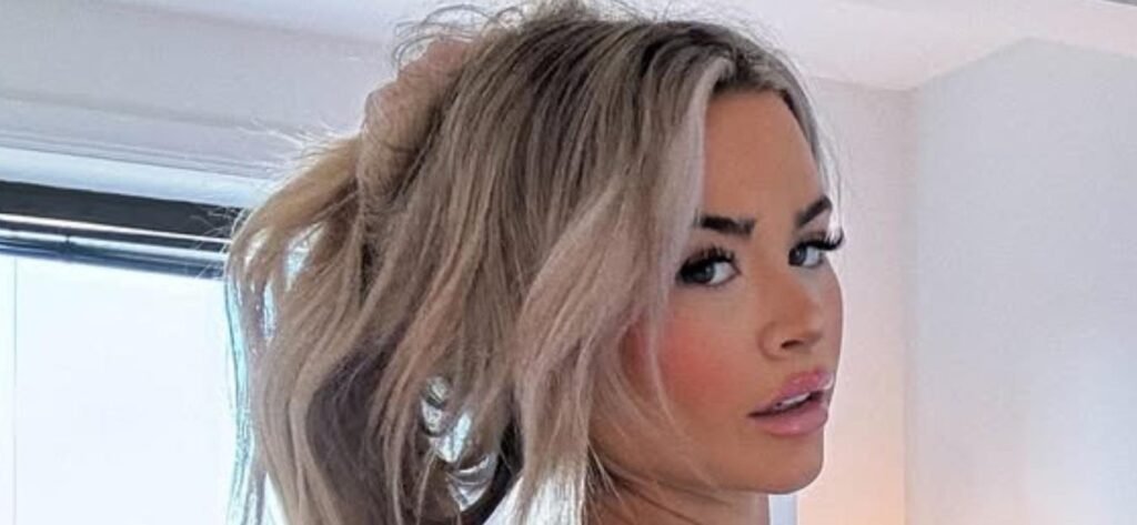 Emily Elizabeth Puts On A Sizzling Display In Her Skintight Black Dress