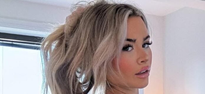 Emily Elizabeth Puts On A Sizzling Display In Her Skintight Black Dress