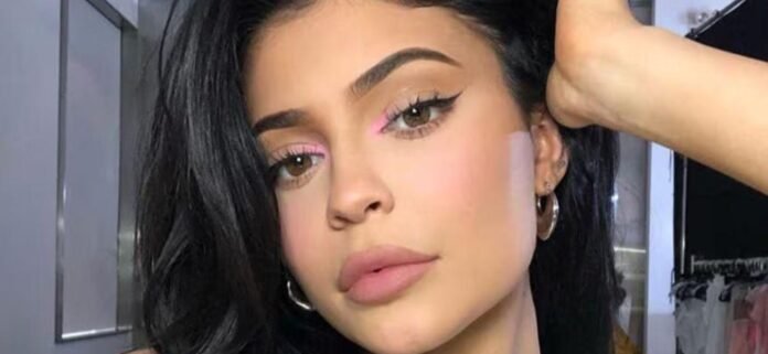 Kylie Jenner Popping Out Of Gold Bikini Is Clearly '50% Plastic Surgery'