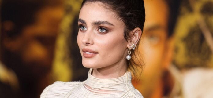 Taylor Hill Peels Back Outfit To Reveal Lacy Bikini Top