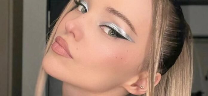 Dove Cameron Shows Off Her G-String While Sucking On A Lollipop