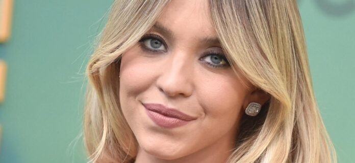Sydney Sweeney Popping Out Her Knitted Bikini Is A 'Guilty Pleasure'