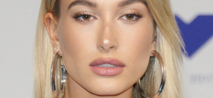 Hailey-Bieber-blonde-hoops-1300.jpg Hailey Bieber Told Butt-Baring Underwear Unnecessary 'To Promote Eye Patches'