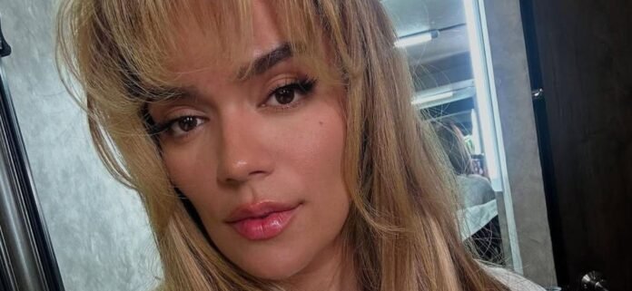 Karol G Stuns in Barely-There Gold Bikini During Beach Getaway