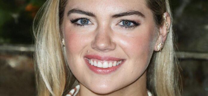 Kate-Upton-stripes-1300.jpg Kate Upton In Plunging Braless Dress Told She 'Gives Good Cleavage'