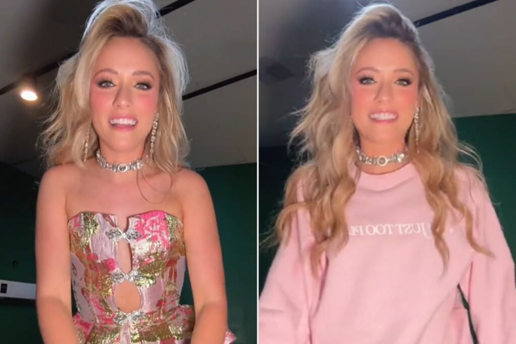 Emily Ann Roberts Avoids Wardrobe Malfunction by Throwing on a Sweatshirt to Perform