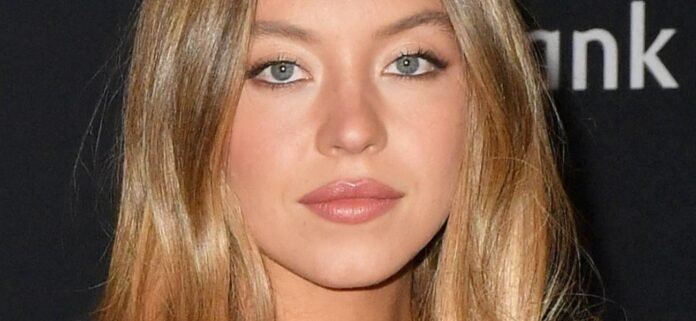 Sydney-Sweeney-black-mega-1300.jpg Sydney Sweeney In Tropical Bikini Is All Smiles By The Pool