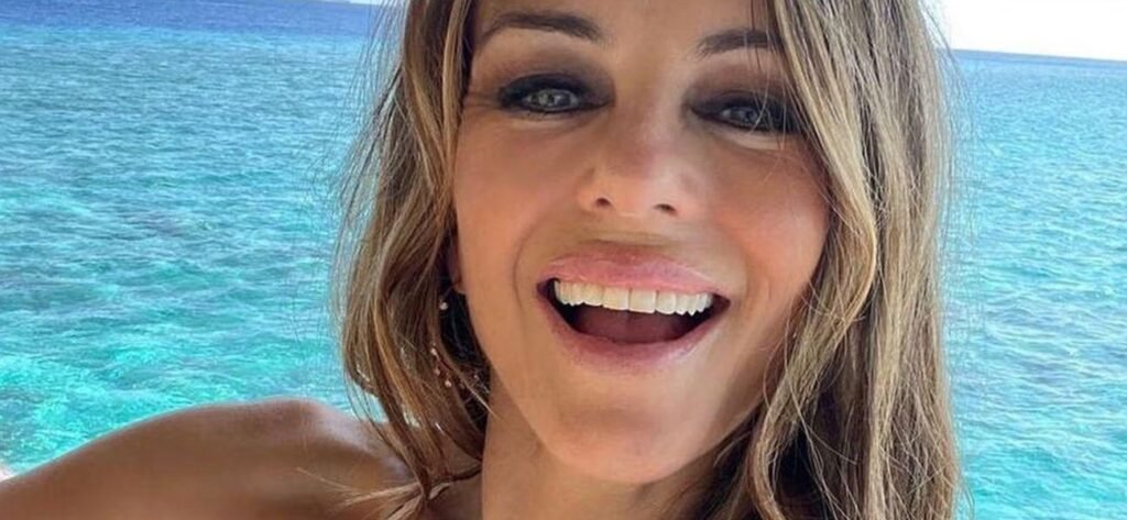 Elizabeth Hurley In Tiny Teal Swimsuit Shares Her 'Secret To Flattering Bikini Pics'