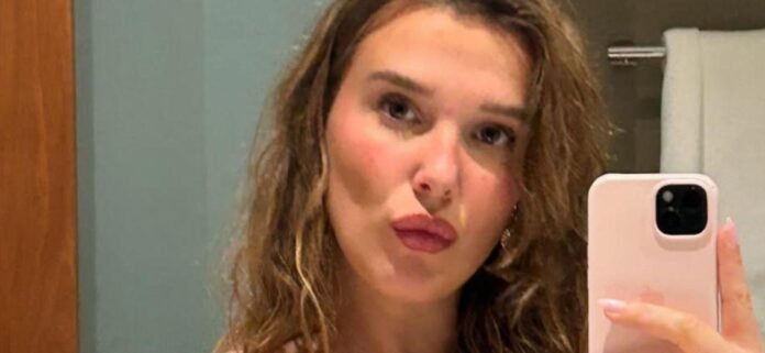 Millie Bobby Brown Glows In Glittering Two-Piece During Tropical Escape