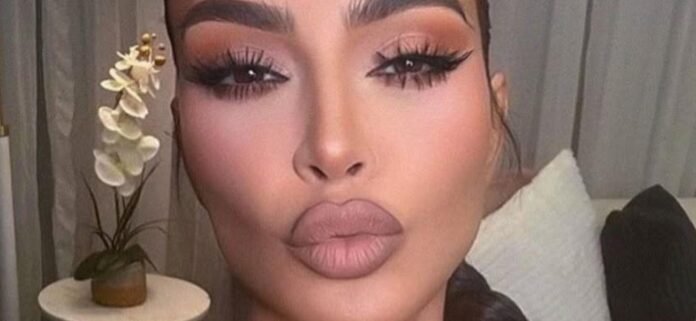 kim-kardashian-2.jpg Kim Kardashian Turns Up The Heat In A Dripping-Wet Pink Bikini Shoot