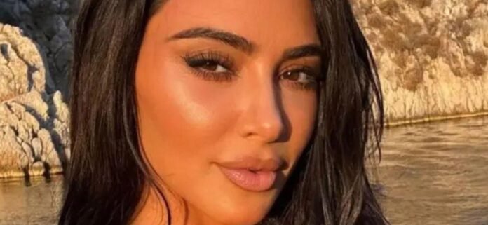 Kim Kardashian Soaks Up The Sun In A Barely-There Black Bikini Moment
