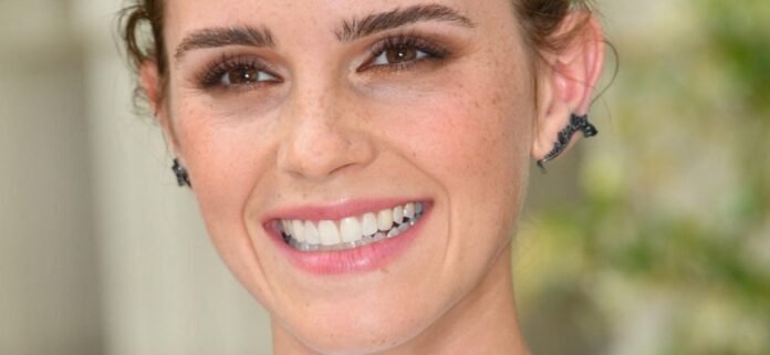 Emma Watson's Cropped Shirt Lifts Up With Nothing Underneath