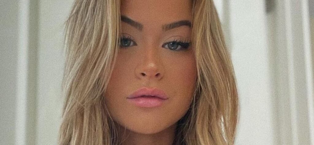 Emily Elizabeth Teases A Peek At Her Sculpted Abs In Her Two-Piece Dress